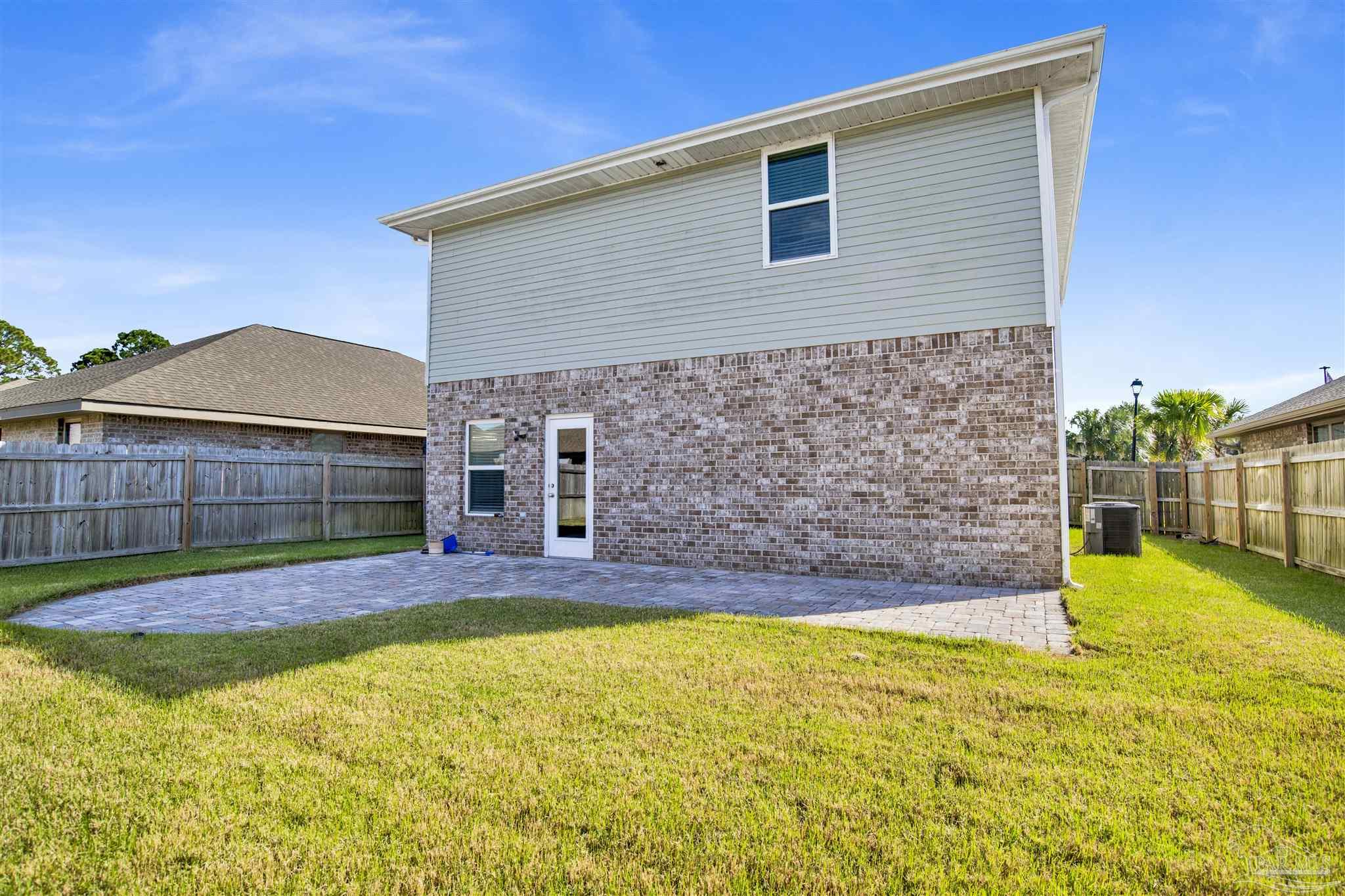 12295 Pinfish Road Pensacola, FL 32506 - Photo 33 of 34 a view of a backyard with a small pool