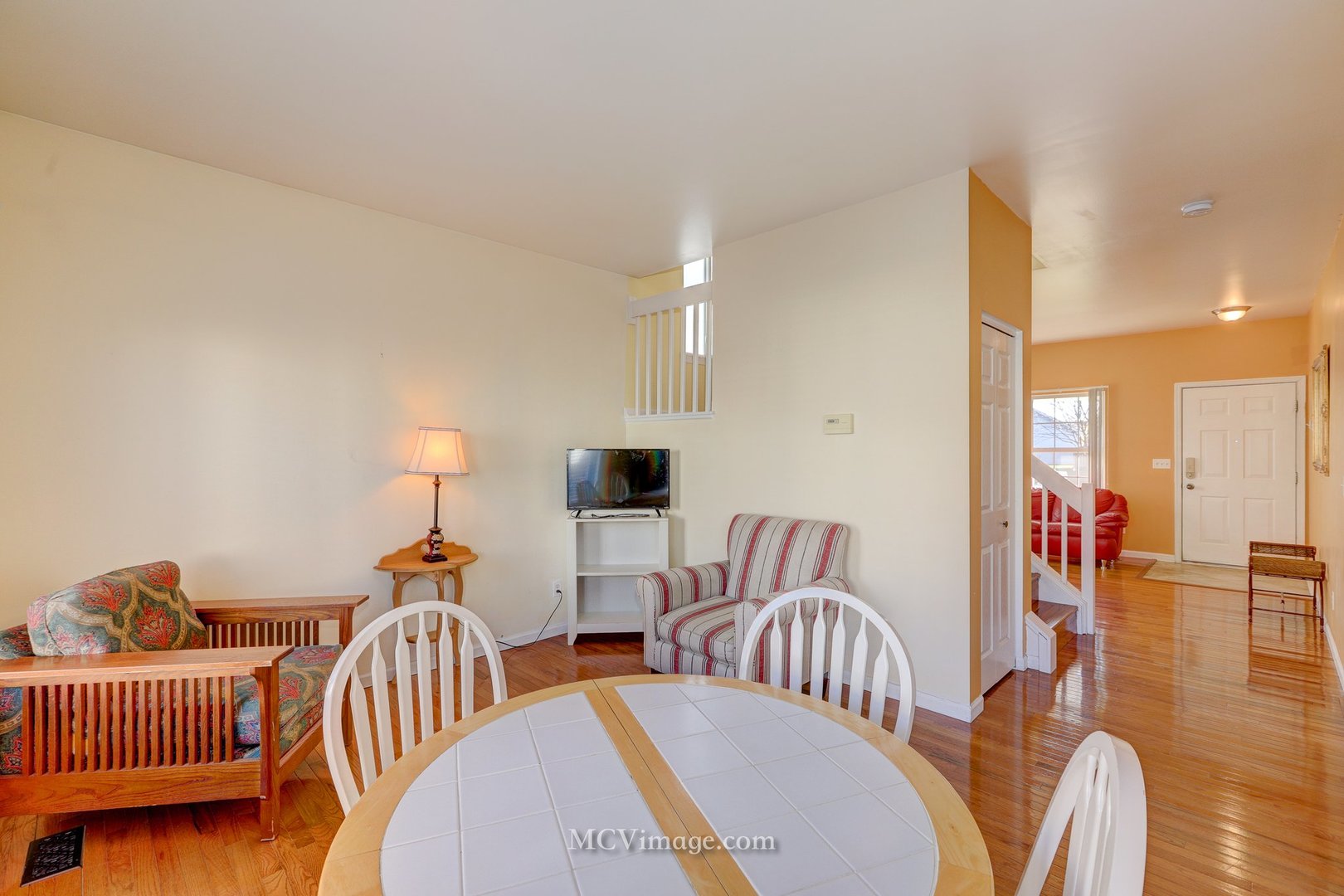 317 Reston Circle Romeoville, IL 60446 - Photo 15 of 15 a living room with furniture and a lamp