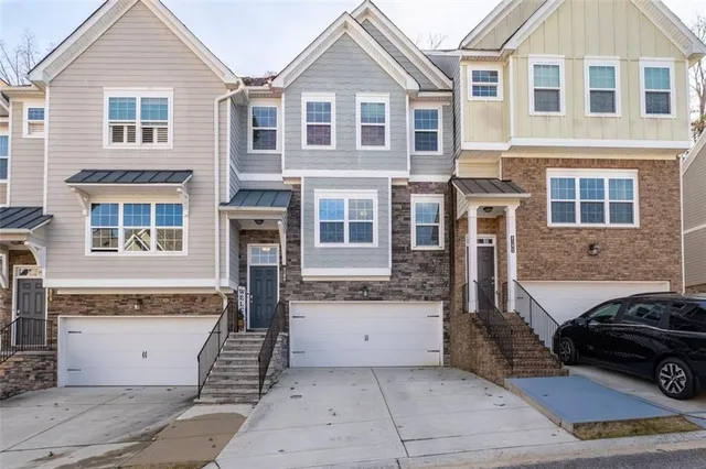 a front view of a house with a garage