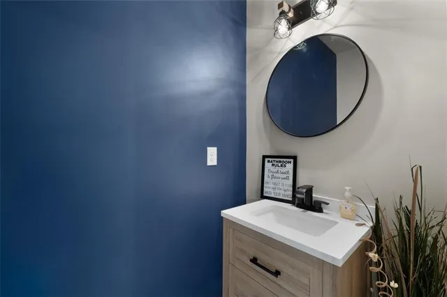 a bathroom with a sink and a vanity