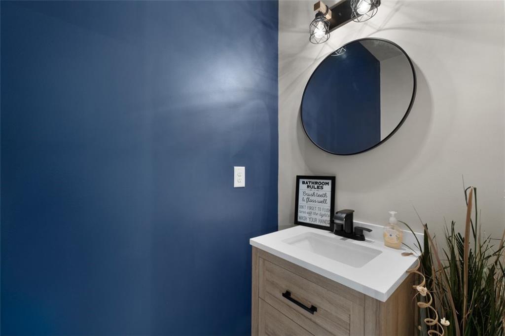 4180 Chatham Ridge Drive Buford, GA 30518 - Photo 14 of 43 a bathroom with a sink and a vanity