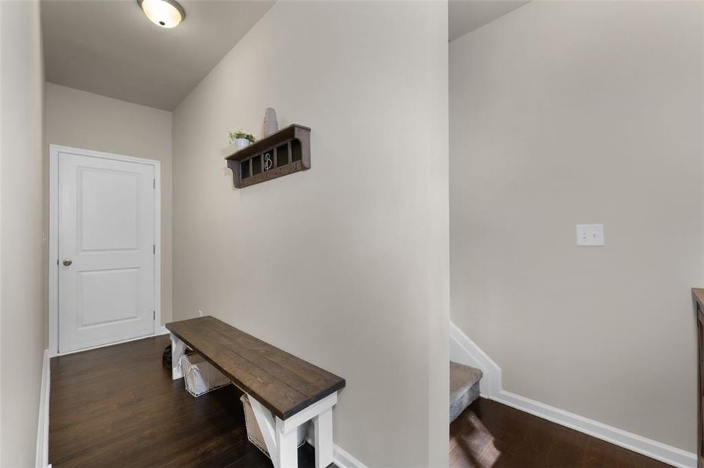 4180 Chatham Ridge Drive Buford, GA 30518 - Photo 17 of 43 a view of staircase with wooden floor
