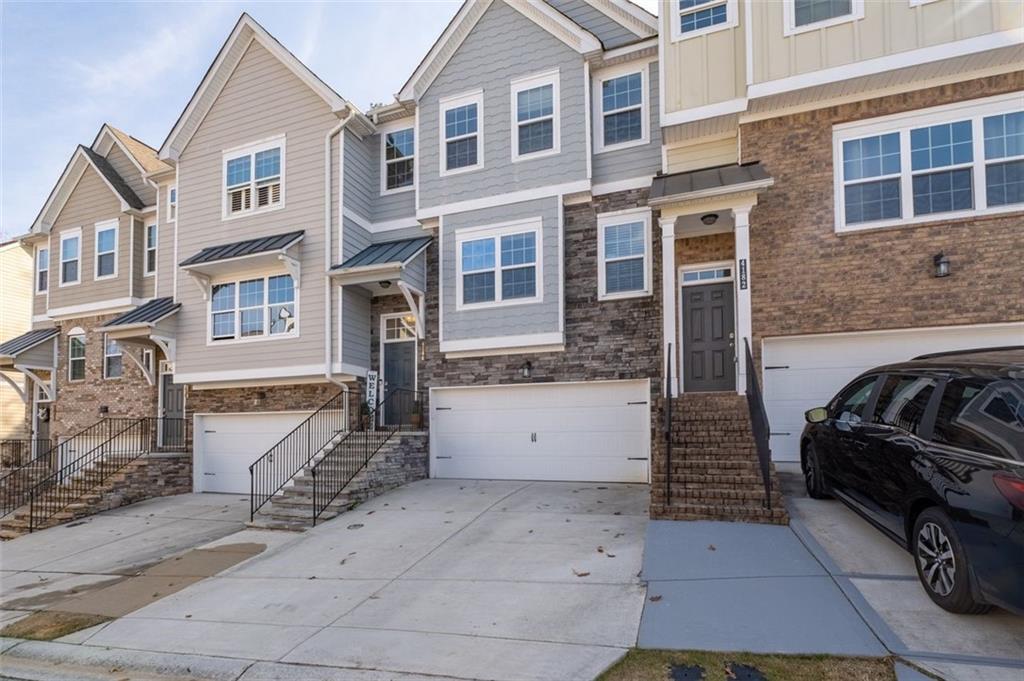 4180 Chatham Ridge Drive Buford, GA 30518 - Photo 2 of 43 a view of a car park in front of house
