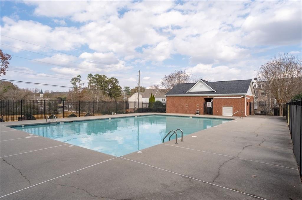 4180 Chatham Ridge Drive Buford, GA 30518 - Photo 32 of 43 a view of a house with pool yard and lake view