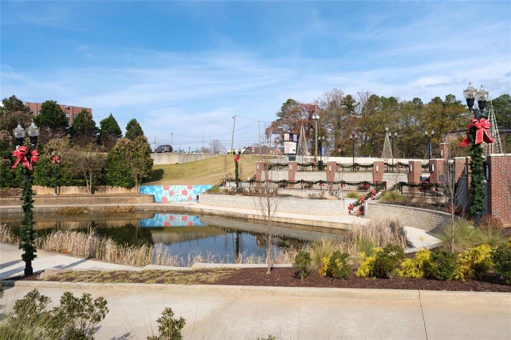 4180 Chatham Ridge Drive Buford, GA 30518 - Photo 36 of 43 a view of swimming pool with outdoor seating and plants