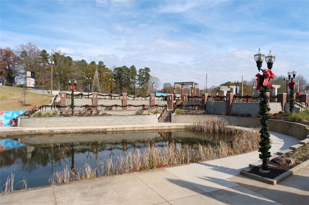 4180 Chatham Ridge Drive Buford, GA 30518 - Photo 37 of 43 a view of a swimming pool with a patio