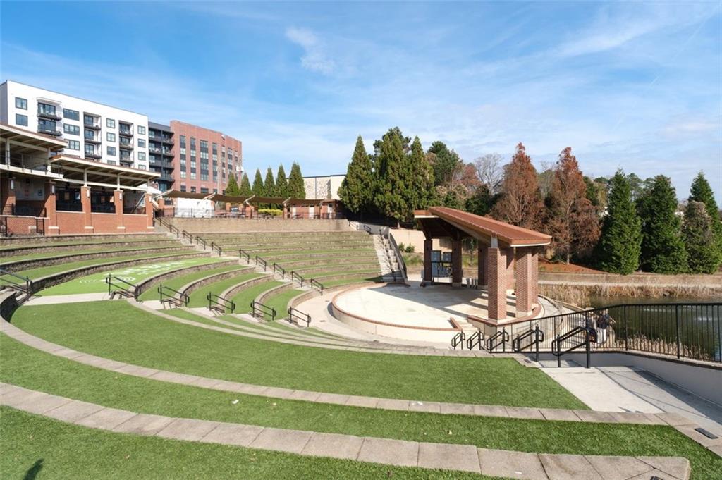 4180 Chatham Ridge Drive Buford, GA 30518 - Photo 40 of 43 a view of a swimming pool with a patio