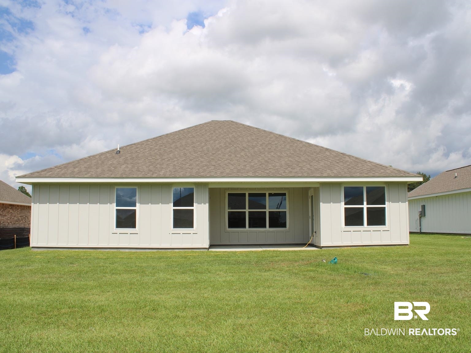 24385 Ringneck Loop Elberta, AL 36530 - Photo 32 of 33 Rear view of house featuring a yard