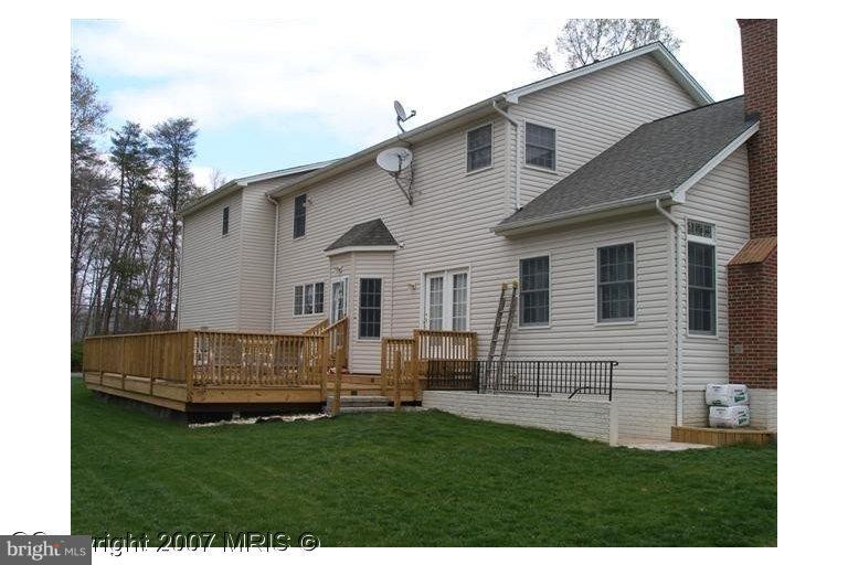 7201 Wesley Road Springfield, VA 22150 - Photo 2 of 11 a view of house with backyard