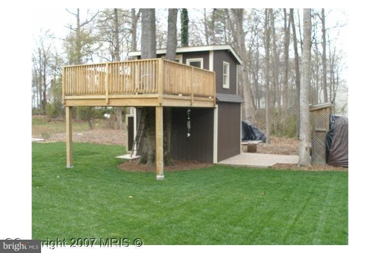 7201 Wesley Road Springfield, VA 22150 - Photo 11 of 11 a view of a house with a yard and sitting area