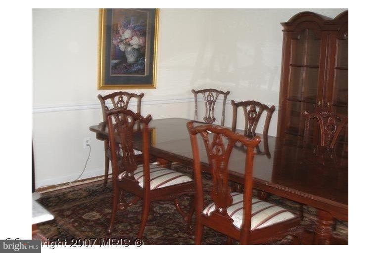 7201 Wesley Road Springfield, VA 22150 - Photo 5 of 11 a view of a dining room with furniture