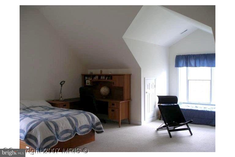 7201 Wesley Road Springfield, VA 22150 - Photo 9 of 11 a bedroom with a bed and chair