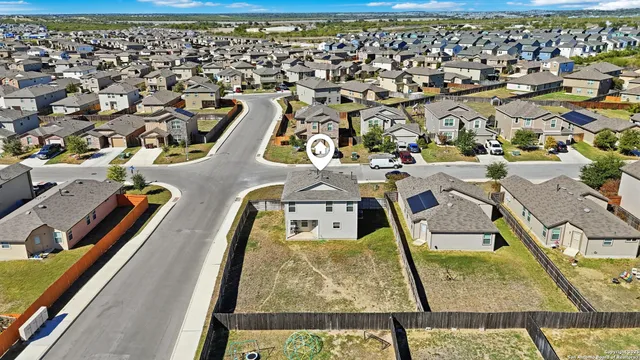 an aerial view of a swimming pool with outdoor space