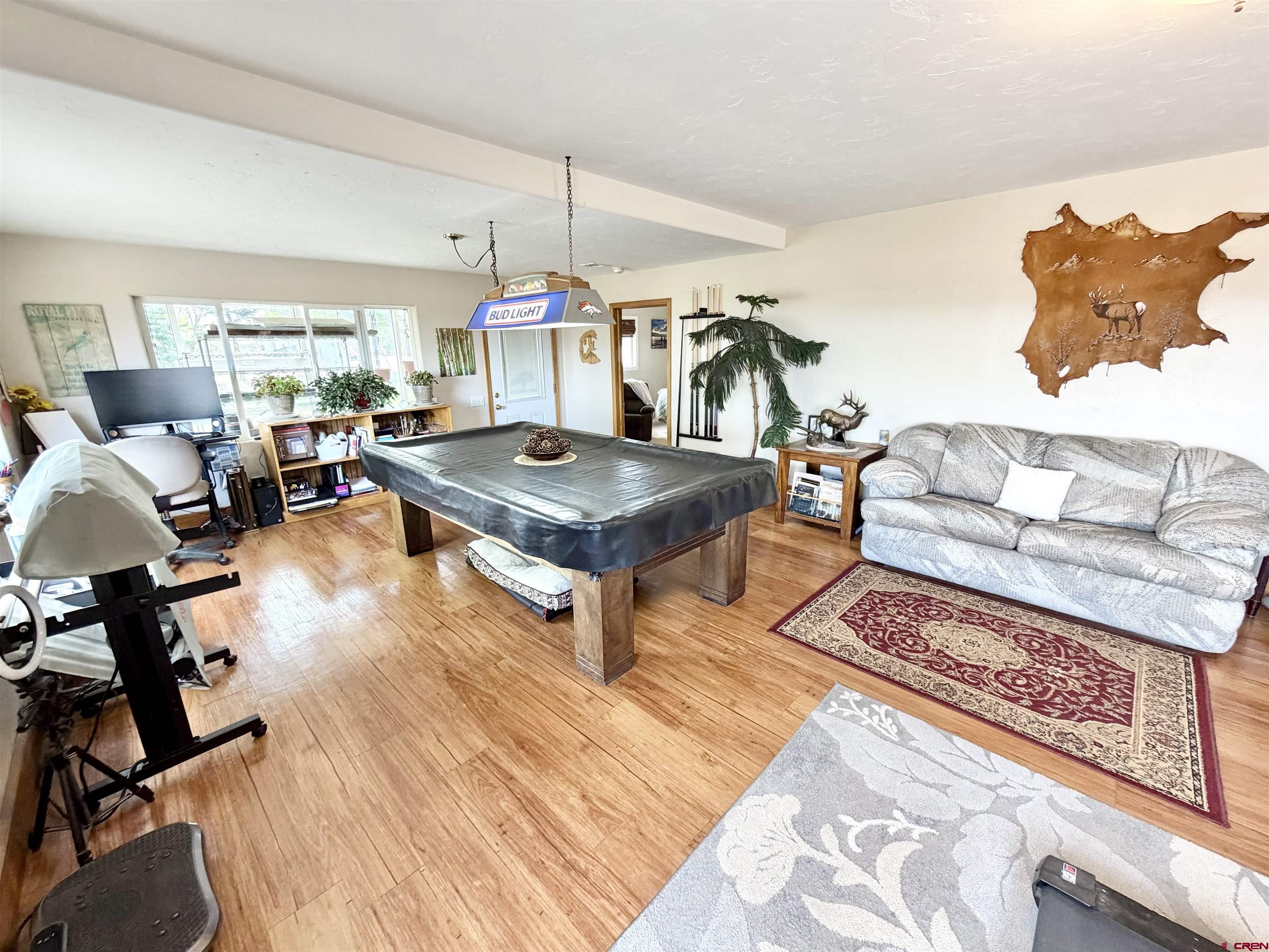 3998 5500th Road Olathe, CO 81425 - Photo 24 of 45 a living room with furniture and a table