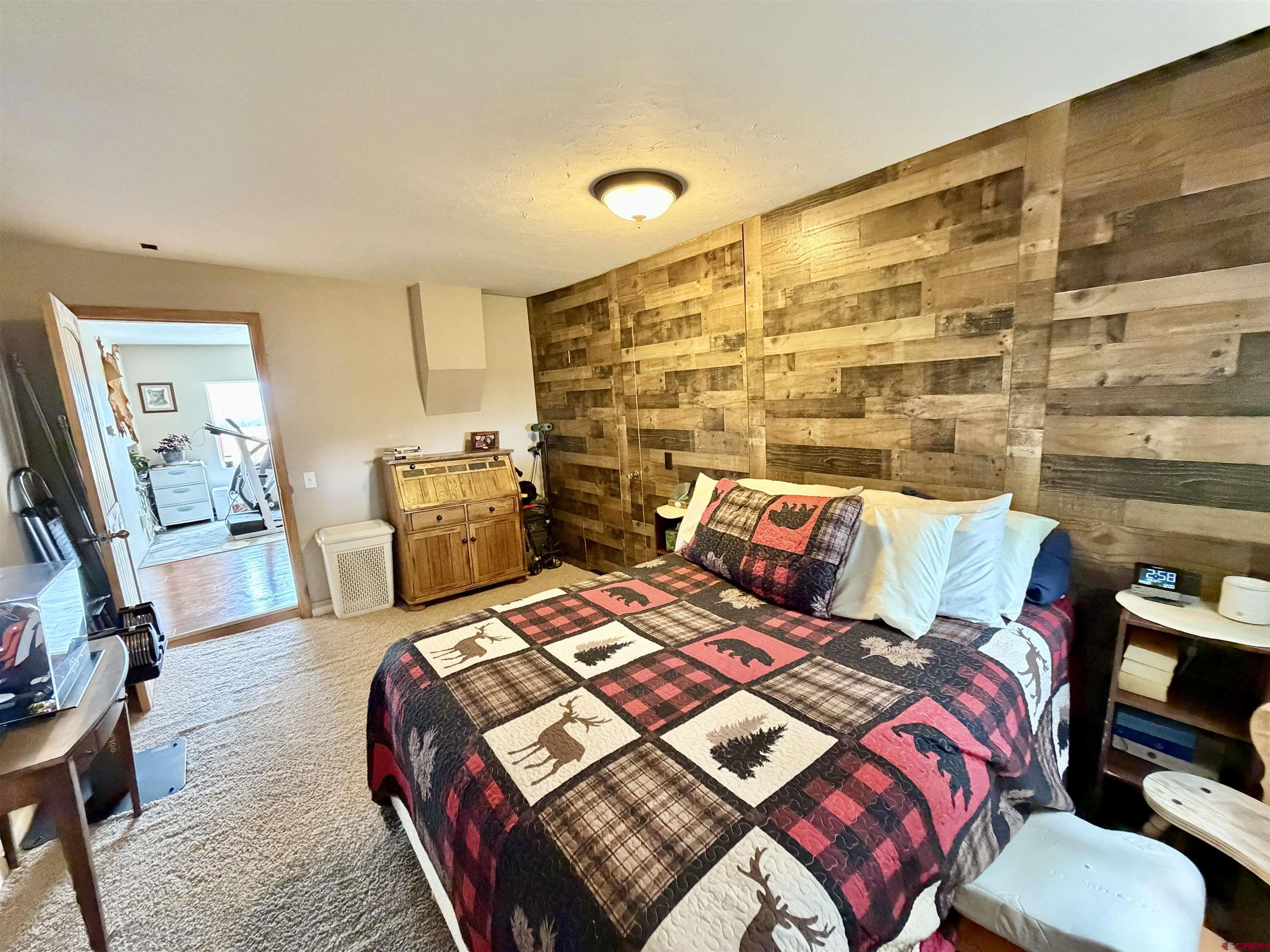 3998 5500th Road Olathe, CO 81425 - Photo 28 of 45 a bed room with two beds and a couch