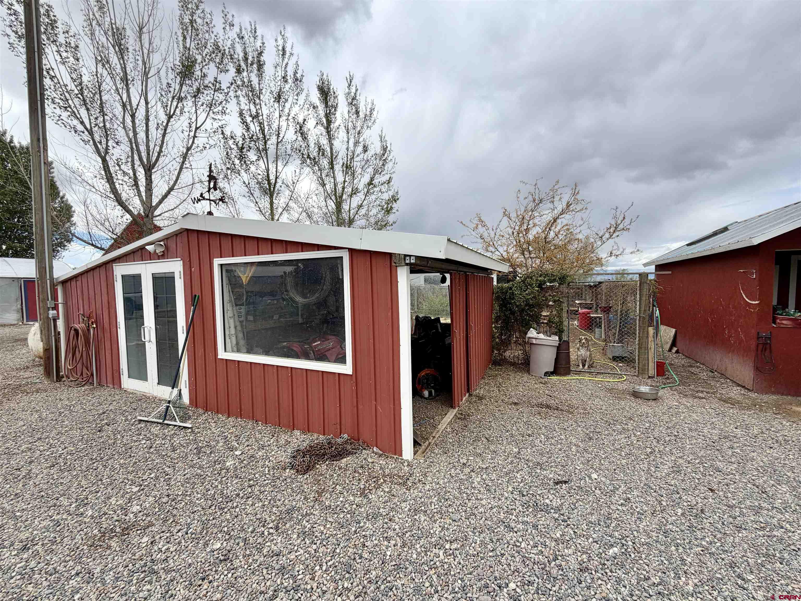 3998 5500th Road Olathe, CO 81425 - Photo 40 of 45 a view of a house with a yard and garage