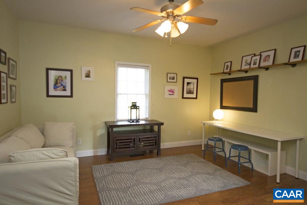 81 Hords Hill Road Ruckersville, VA 22968 - Photo 11 of 34 a living room with furniture and a flat screen tv