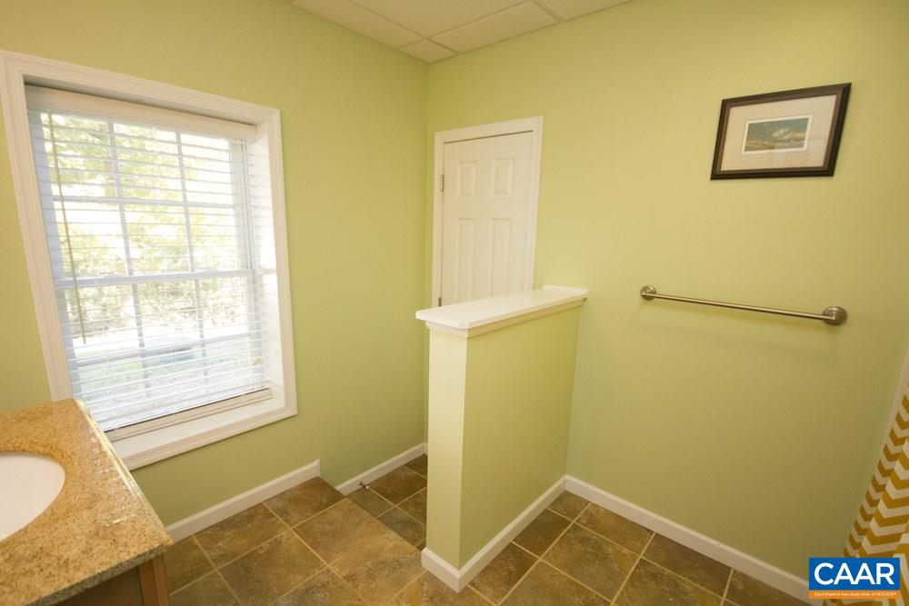 81 Hords Hill Road Ruckersville, VA 22968 - Photo 22 of 34 a bathroom with a tub and a shower