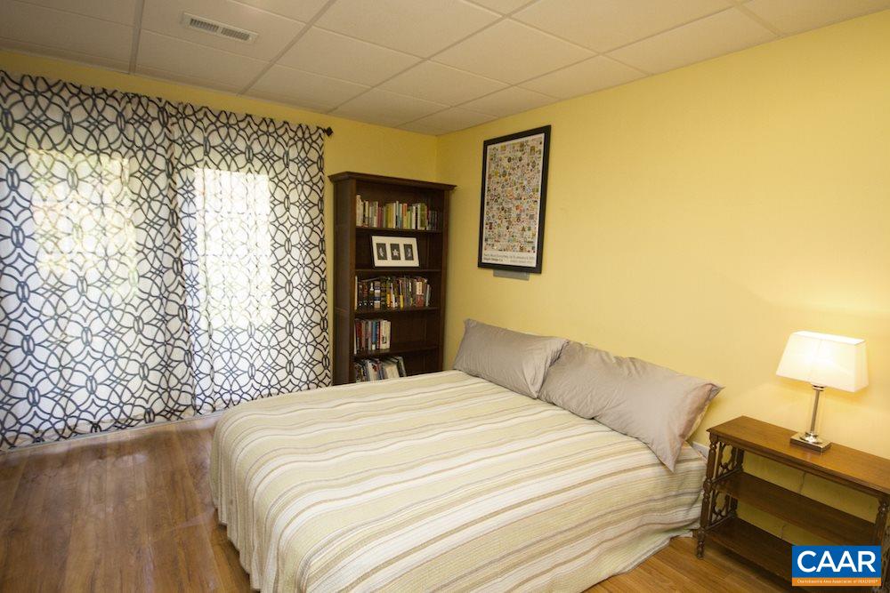 81 Hords Hill Road Ruckersville, VA 22968 - Photo 23 of 34 a bedroom with a bed and a lamp