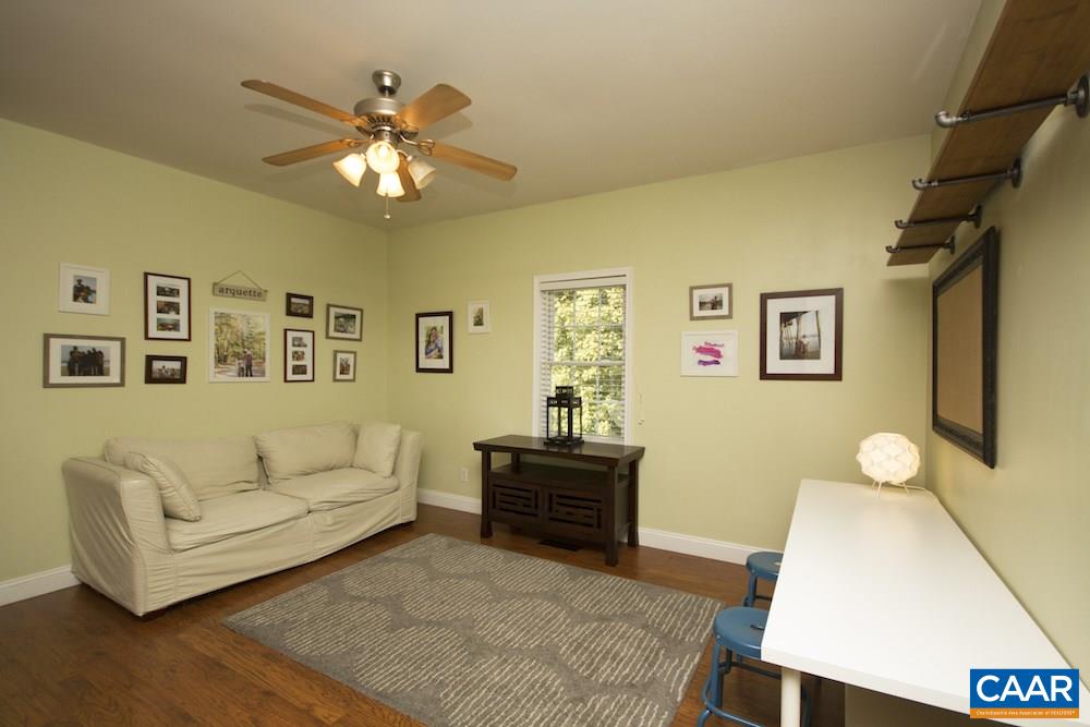 81 Hords Hill Road Ruckersville, VA 22968 - Photo 10 of 34 a living room with furniture and a flat screen tv