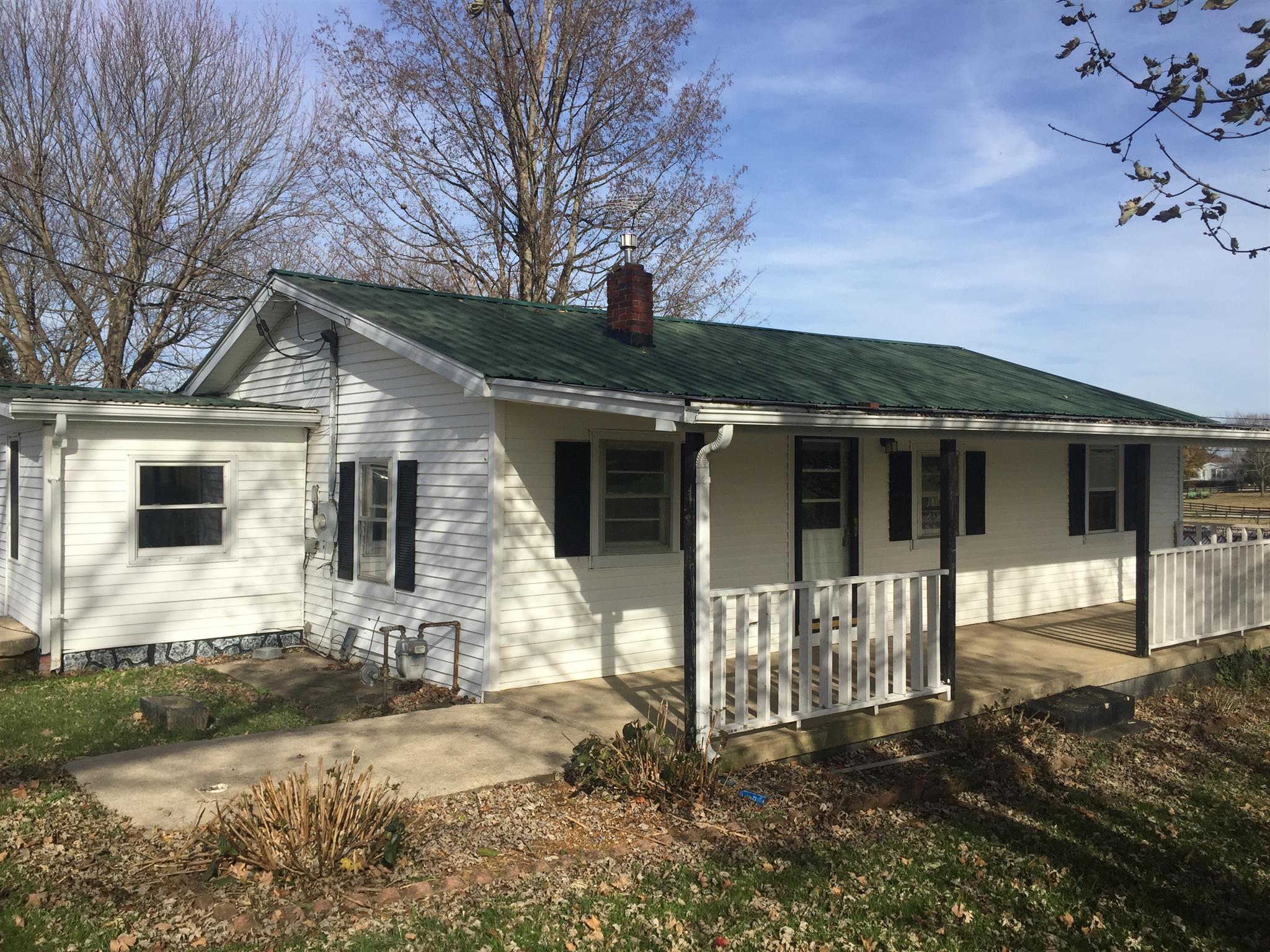506 Dorris Road Portland, TN 37148 - Photo 1 of 8 a front view of a house with a yard