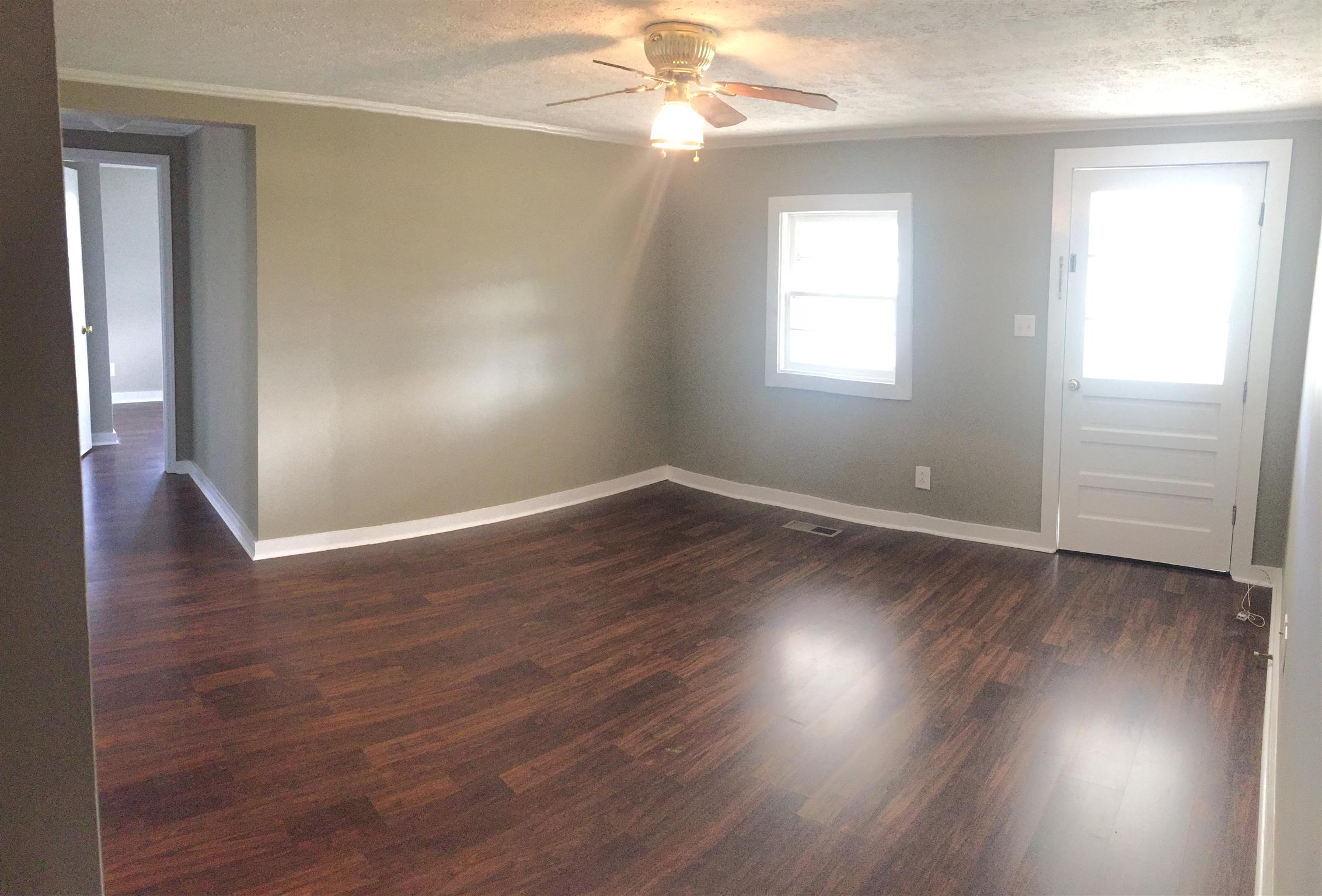 506 Dorris Road Portland, TN 37148 - Photo 4 of 8 wooden floor in an empty room with a window
