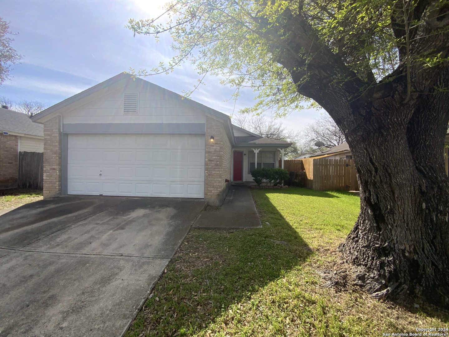 10126 Galesburg San Antonio, TX 78250 - Photo 1 of 17 a front view of house with yard and green space