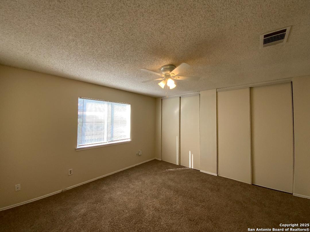 10126 Galesburg San Antonio, TX 78250 - Photo 11 of 17 a view of an empty room with a window