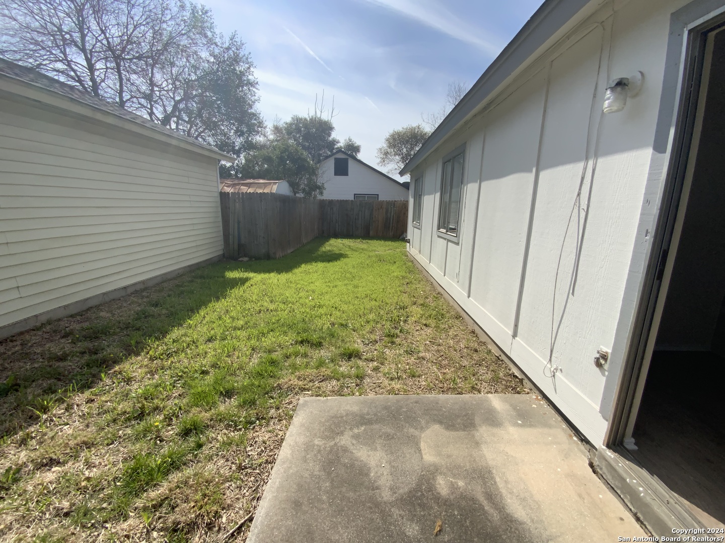 10126 Galesburg San Antonio, TX 78250 - Photo 16 of 17 a view of backyard with pathway