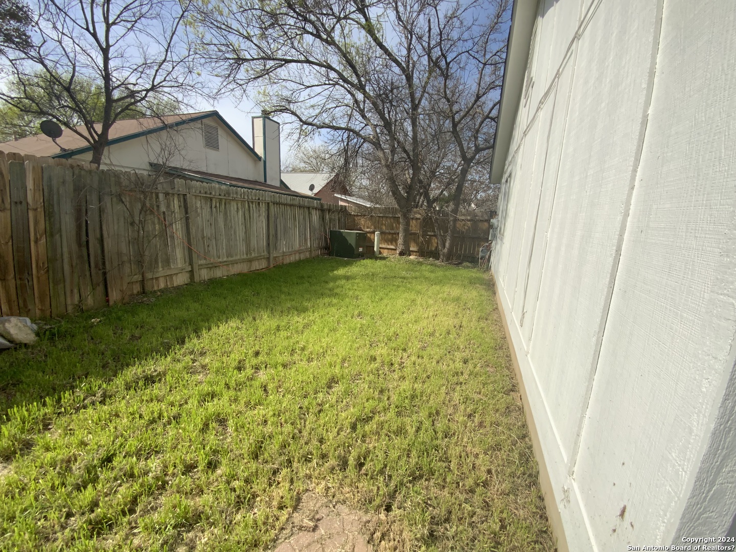 10126 Galesburg San Antonio, TX 78250 - Photo 17 of 17 a view of a backyard with wooden fence