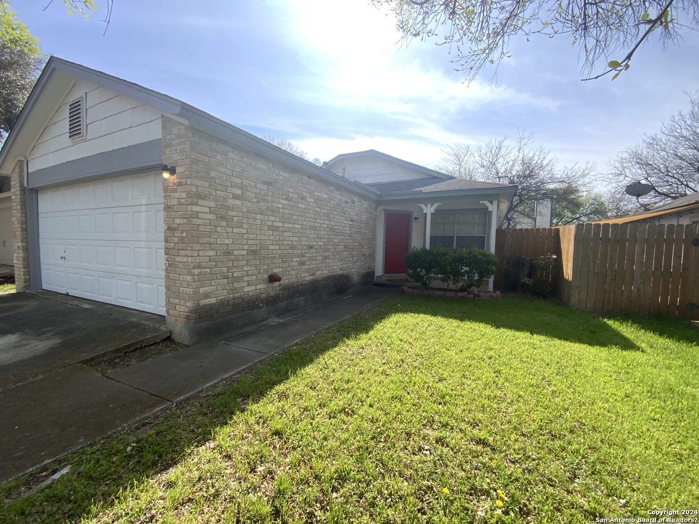 10126 Galesburg San Antonio, TX 78250 - Photo 2 of 17 a view of a yard in front of house