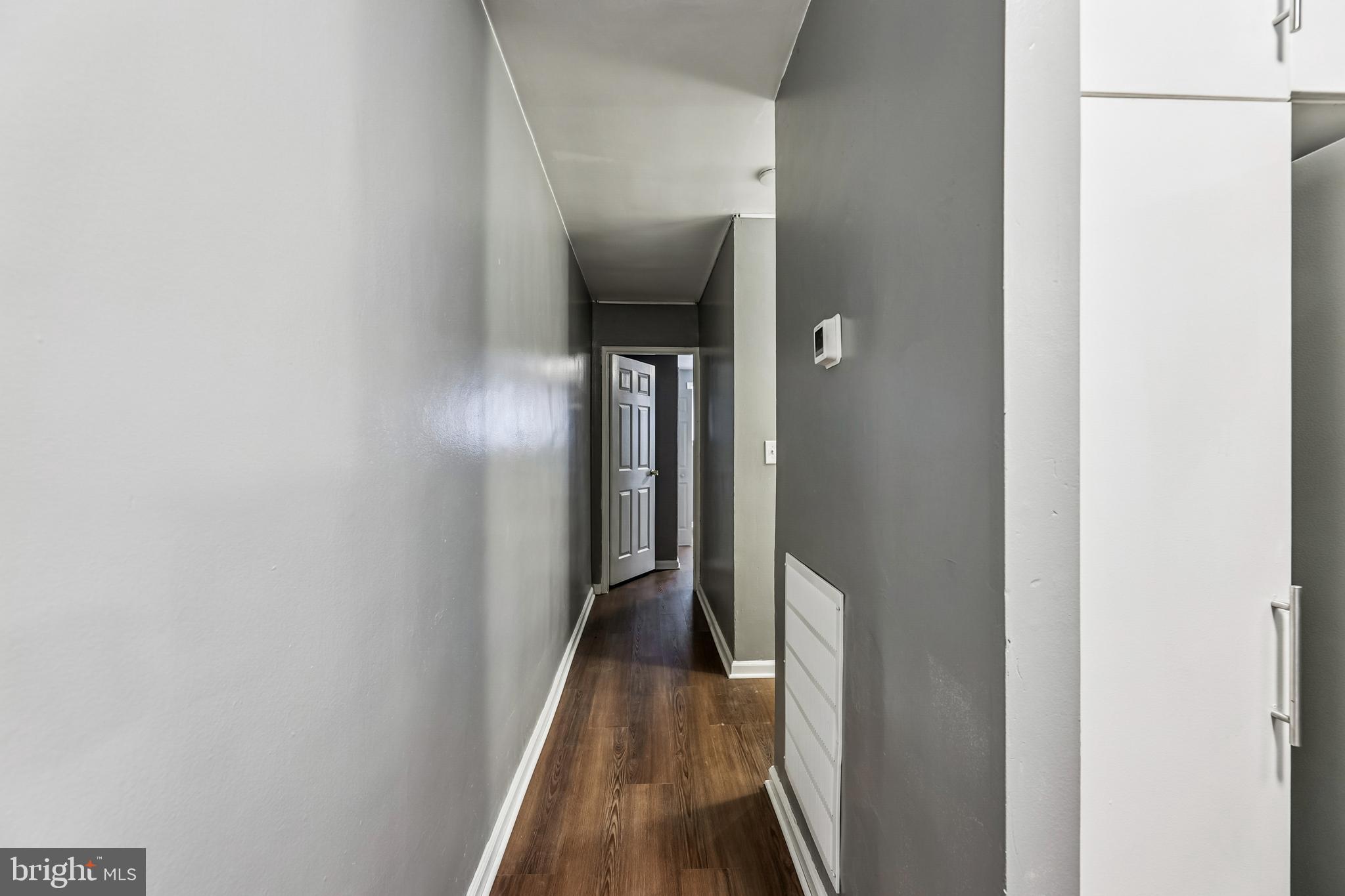 2640 Wade Road Southeast, Unit 2 Washington, DC 20020 - Photo 3 of 23 a view of a hallway with wooden floor