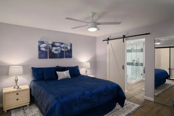 a bedroom with a bed and a walk in closet