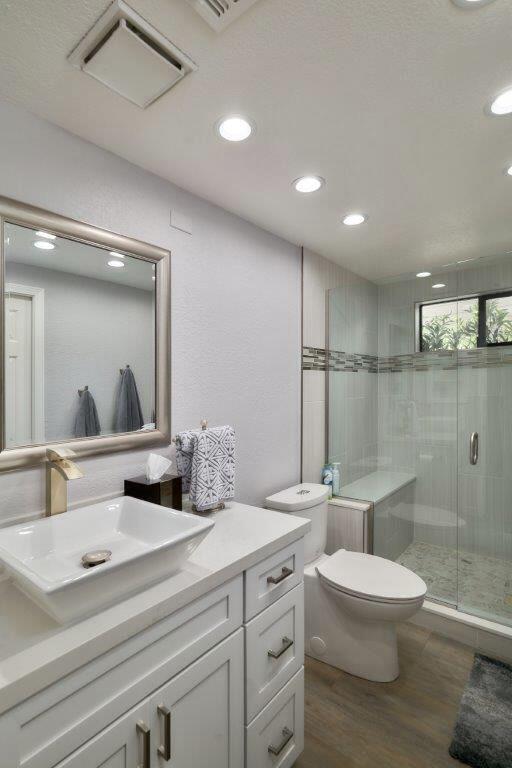 25 Maximo Way Palm Desert, CA 92260 - Photo 9 of 15 a bathroom with a double vanity sink toilet and a mirror
