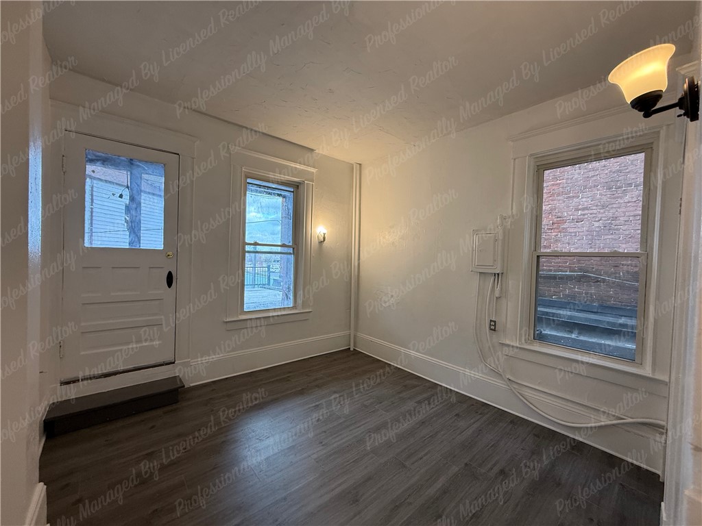 44 West High Street, Unit B Springfield, OH 45502 - Photo 26 of 31 This bright space features sleek flooring and ample natural light, perfect for diverse arrangements.