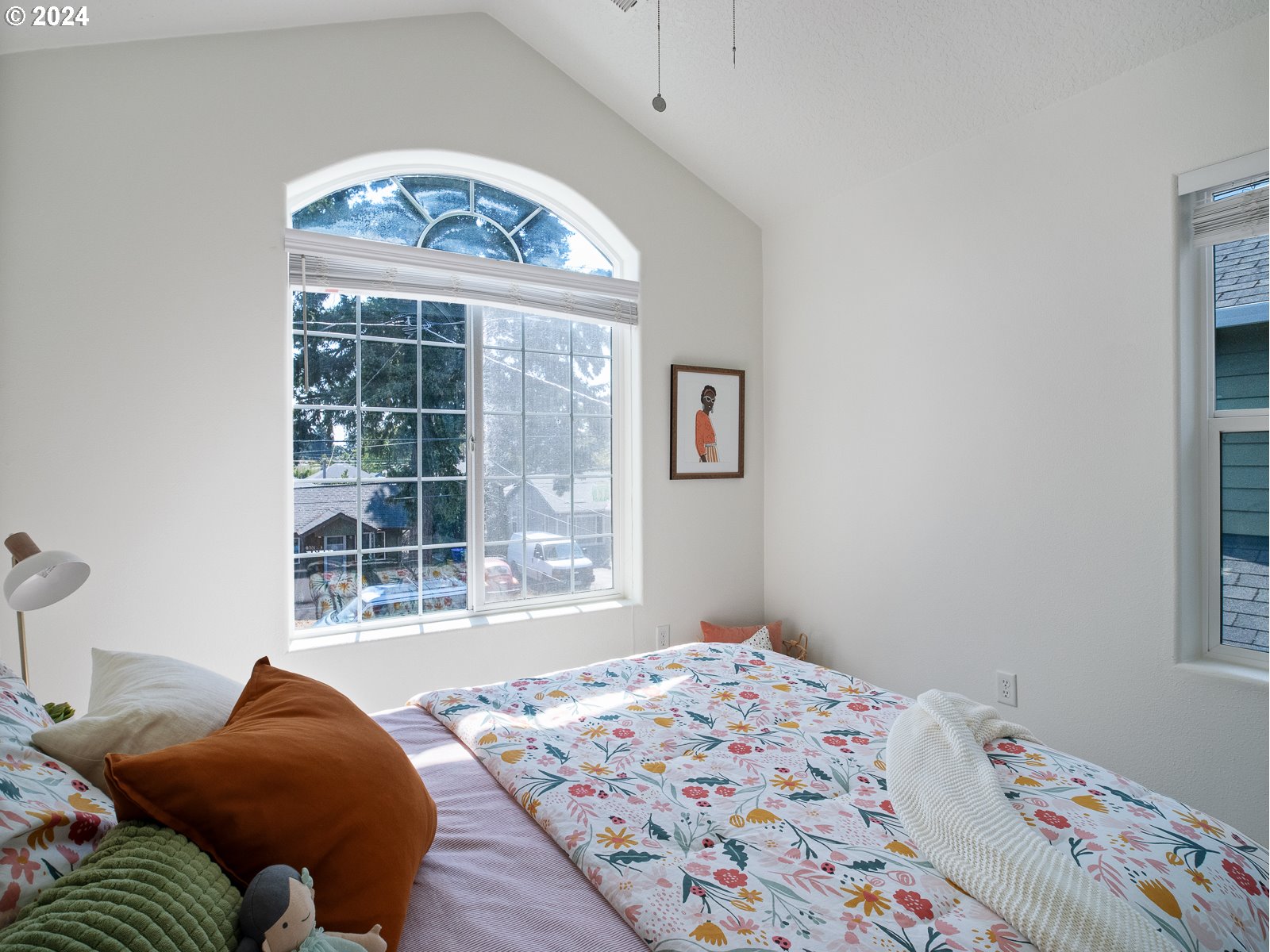 5541 Southeast Henderson Street Portland, OR 97206 - Photo 18 of 26 a bedroom with a bed and a window