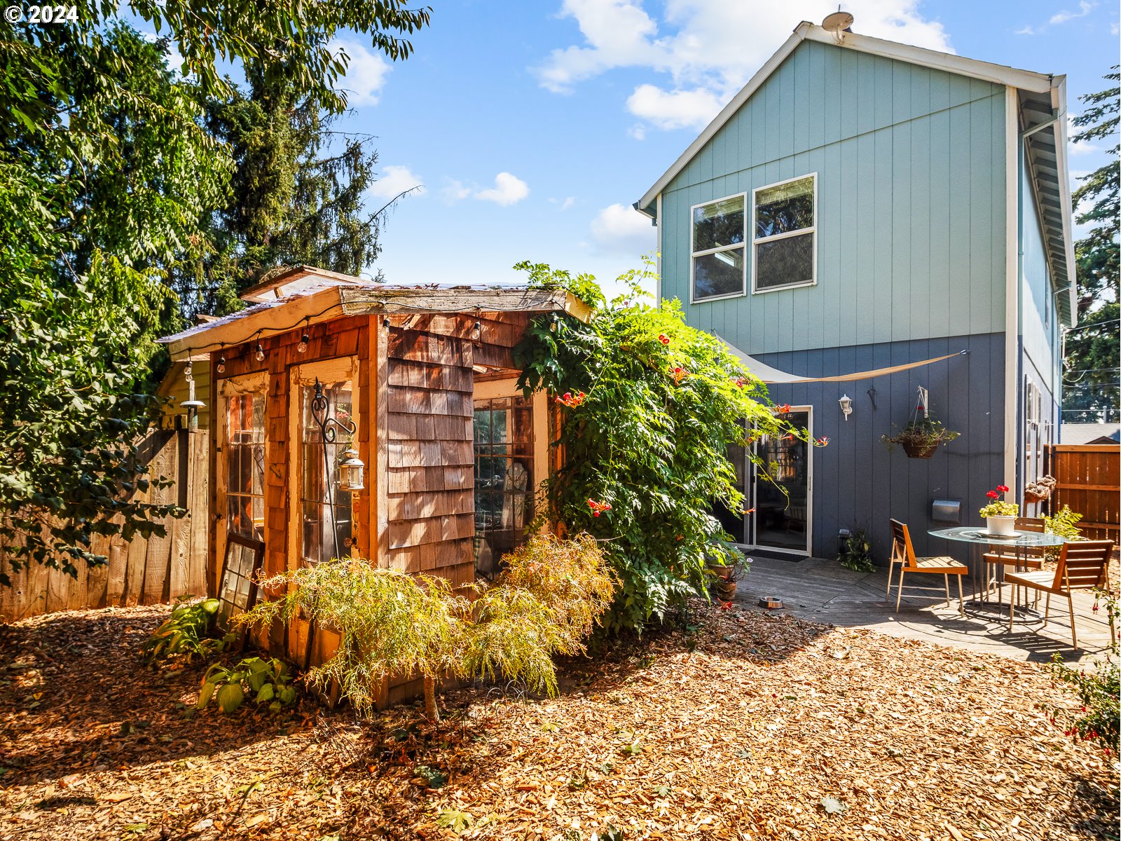 5541 Southeast Henderson Street Portland, OR 97206 - Photo 22 of 26 a front view of a house with a yard