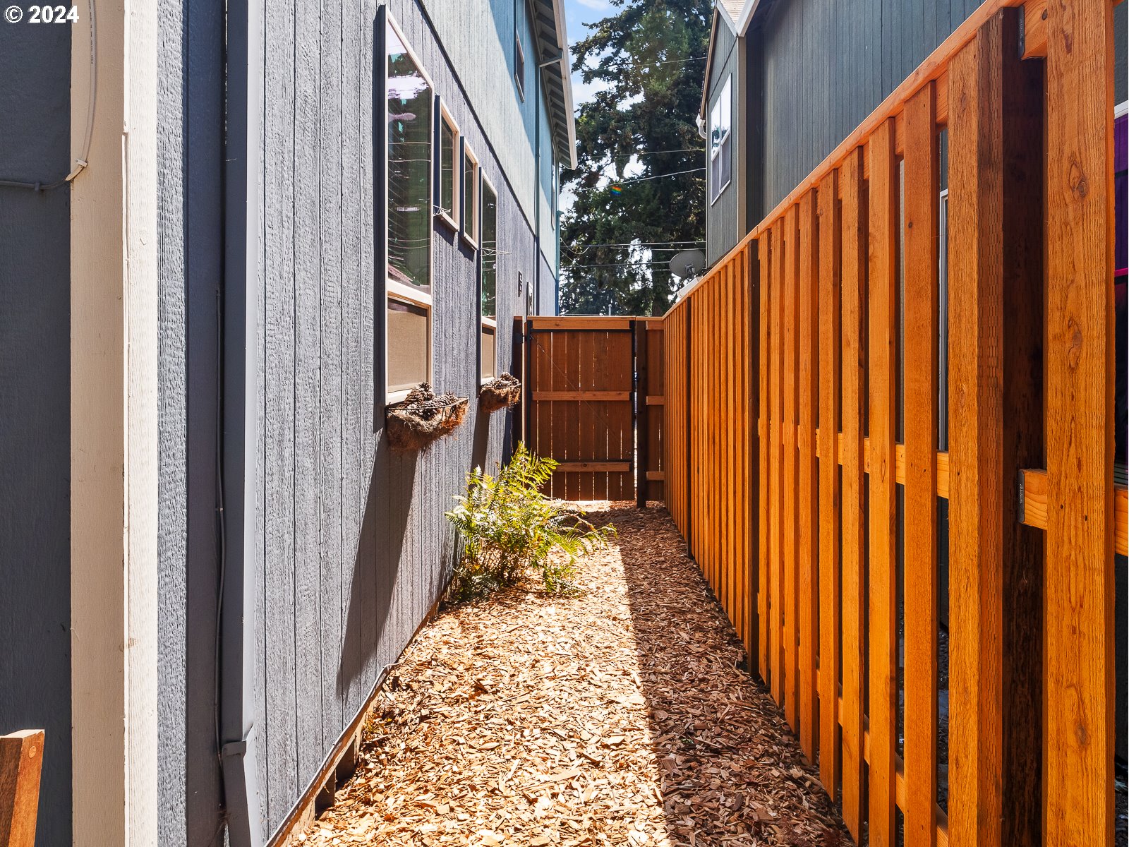 5541 Southeast Henderson Street Portland, OR 97206 - Photo 23 of 26 a view of a pathway of a house with wooden floor