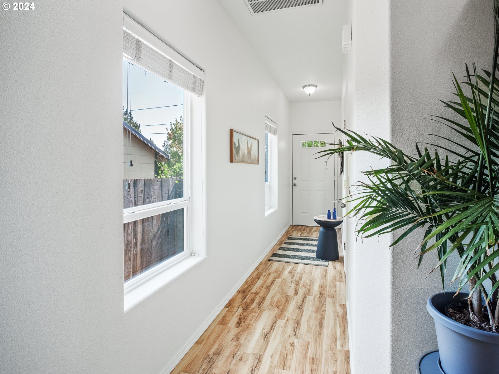 5541 Southeast Henderson Street Portland, OR 97206 - Photo 3 of 26 a view of entryway with wooden floor