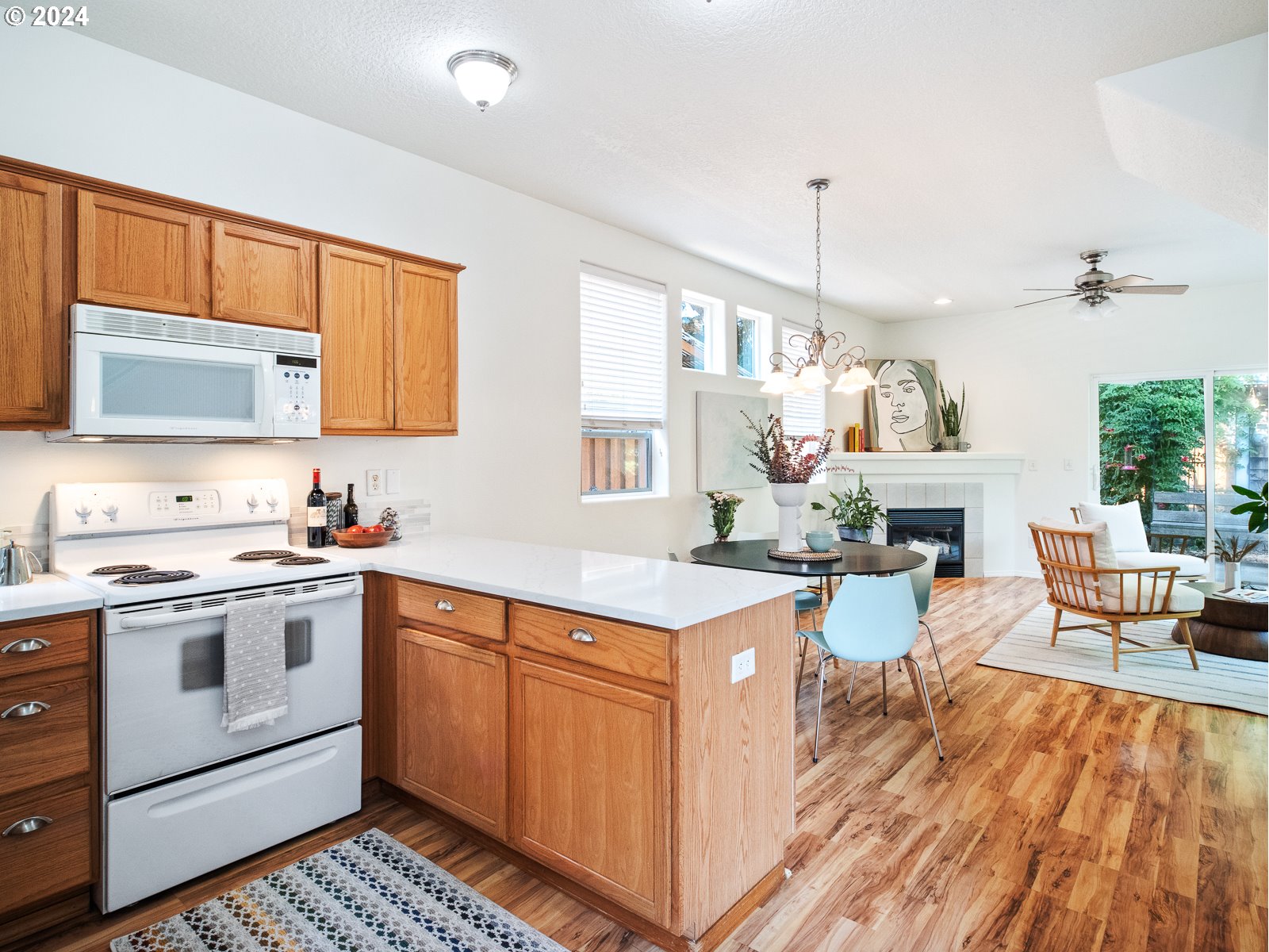 5541 Southeast Henderson Street Portland, OR 97206 - Photo 5 of 26 a kitchen with a sink stove and cabinets