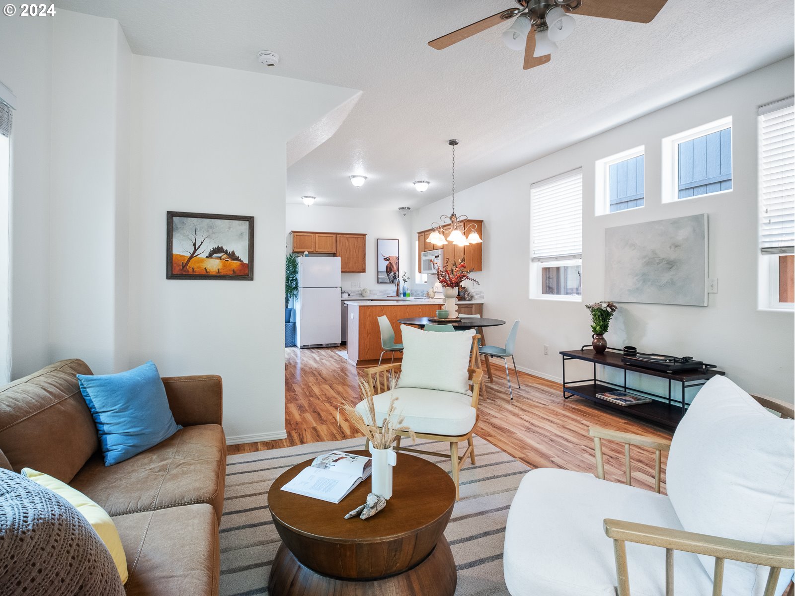 5541 Southeast Henderson Street Portland, OR 97206 - Photo 7 of 26 a living room with furniture kitchen view and a window