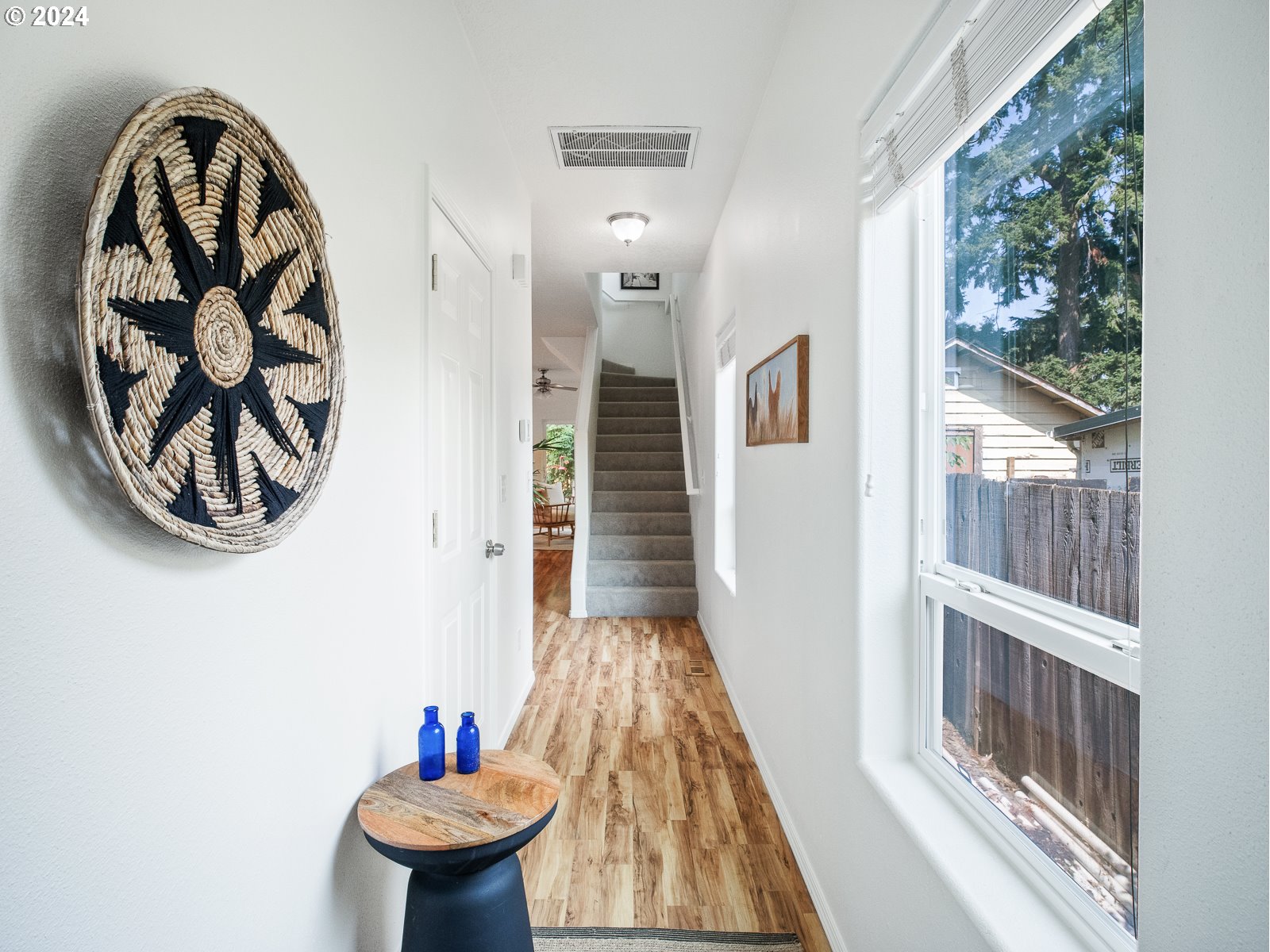 5541 Southeast Henderson Street Portland, OR 97206 - Photo 9 of 26 a bathroom with a toilet and a painting on the wall