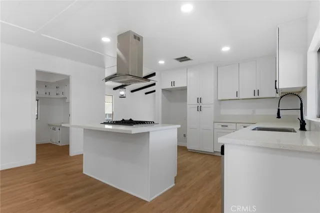 a view of empty room with a fireplace and window