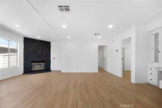 a big room with closet and a fireplace