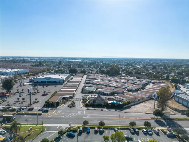 an aerial view of a house with a yard and outdoor seating