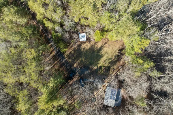 a backyard of a house with lots of trees
