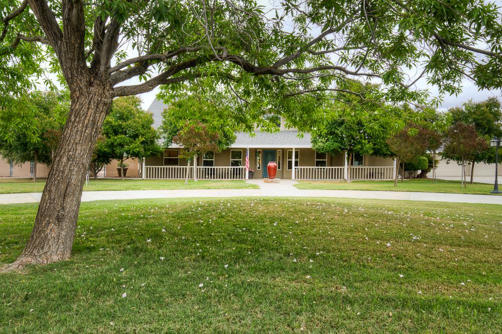 17465 Monreal Road Madera, CA 93636 - Photo 5 of 59 a view of house with a backyard