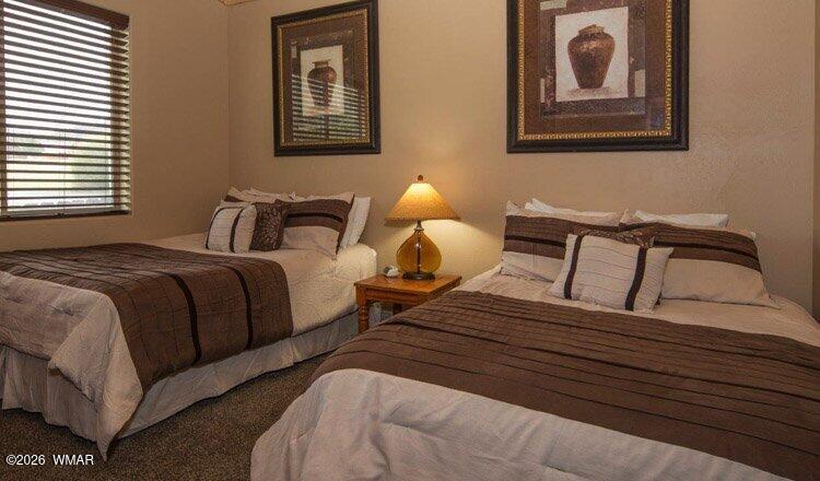 285 Main Street Eagar, AZ 85925 - Photo 13 of 18 a bedroom with two beds and two windows