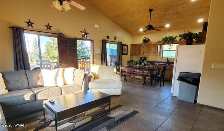 285 Main Street Eagar, AZ 85925 - Photo 7 of 18 a living room with furniture and a large window