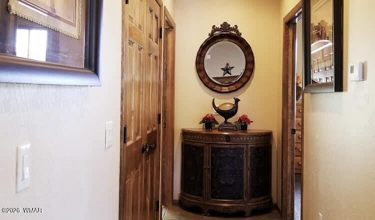285 Main Street Eagar, AZ 85925 - Photo 10 of 18 a view of a hallway with washer and dryer
